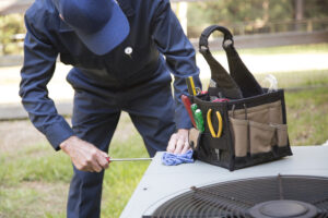 air conditioner Technician services outdoor AC unit
