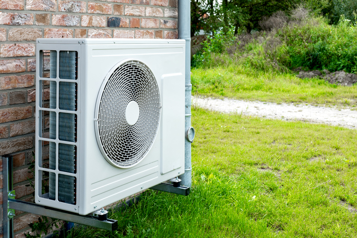 heat pump installed on the exterior of a brick home in pittsburgh